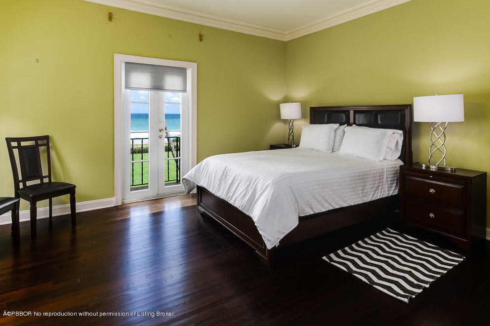 89 Middle Road Palm Beach, FL 33480 - Photo 18 of 23 a bedroom with a bed and wooden floor