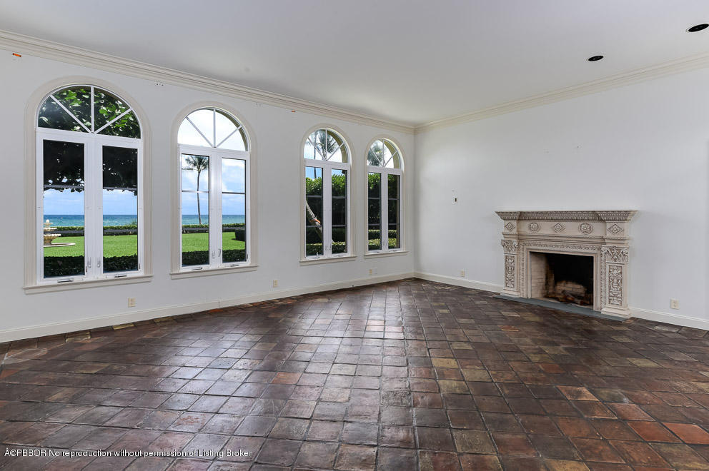 89 Middle Road Palm Beach, FL 33480 - Photo 10 of 23 a view of empty room with fireplace and windows