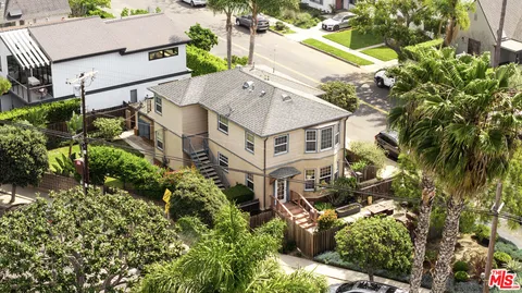 an aerial view of a house with yard