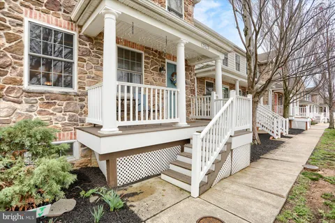 front view of a house with a bench