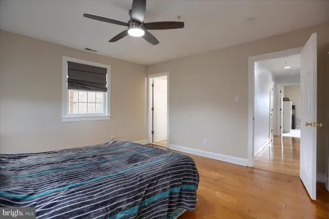 a bedroom with bed and window