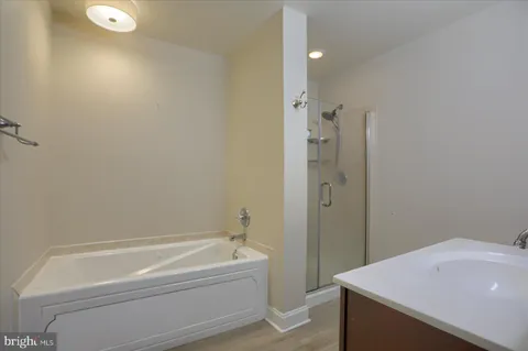 a bathroom with a tub and sink
