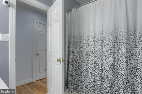 a view of bathroom with shower curtain