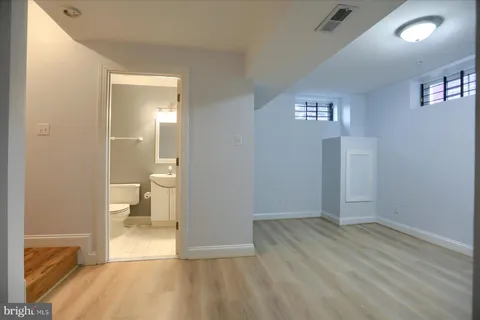 a view of a bathroom from a hallway