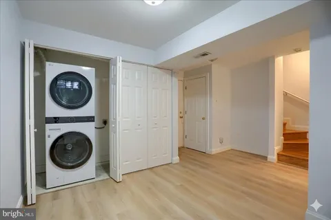 a view of a hallway with washer and dryer