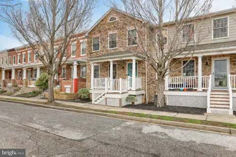 a view of a white building with a large windows