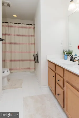 a spacious bathroom with a tub and shower