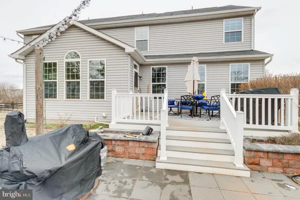 a view of outdoor space with deck and trees