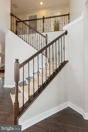 a view of staircase with lots of wooden floor