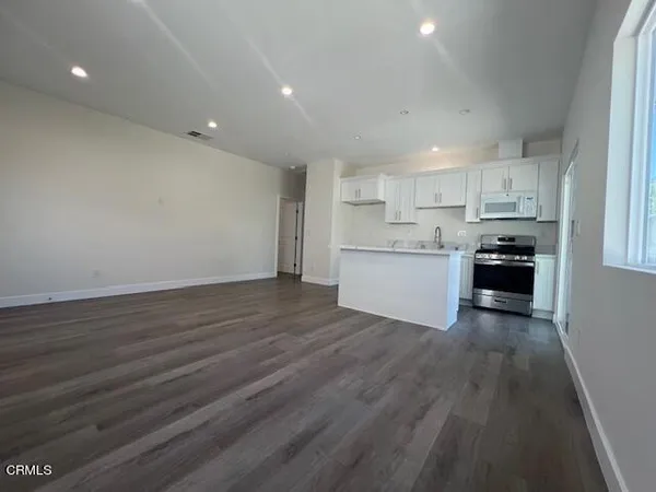 a view of kitchen with wooden floor