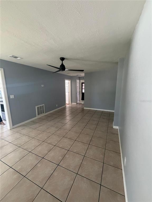 1111 Jersey Avenue St. Cloud, FL 34769 - Photo 5 of 11 a view of a livingroom with an empty space and a window