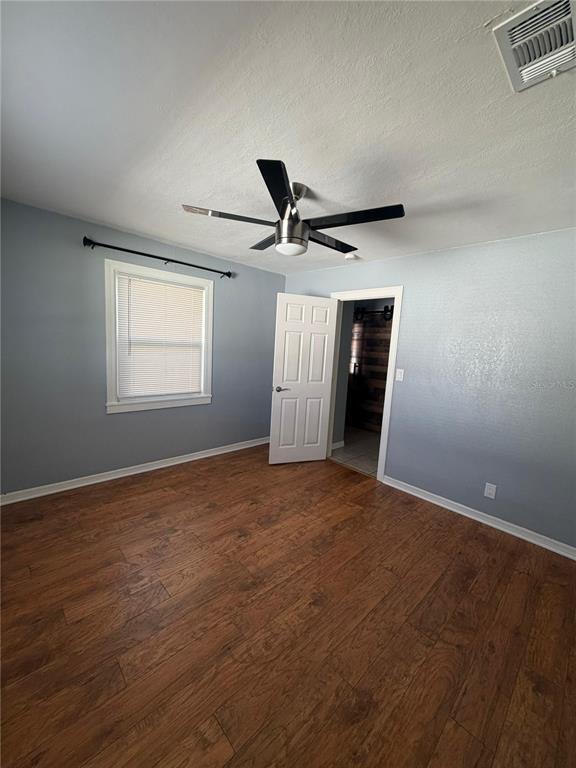 1111 Jersey Avenue St. Cloud, FL 34769 - Photo 6 of 11 a view of a livingroom with a ceiling fan and window