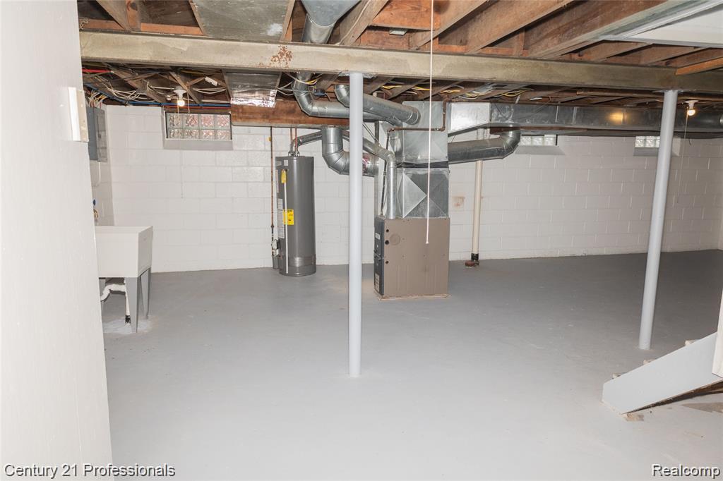 19372 Sunderland Road Detroit, MI 48219 - Photo 29 of 34 Spacious basement featuring painted concrete block walls and a finished concrete floor