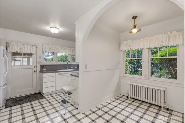 a kitchen with a refrigerator and a stove