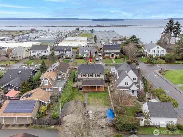 an aerial view of a house with a ocean view