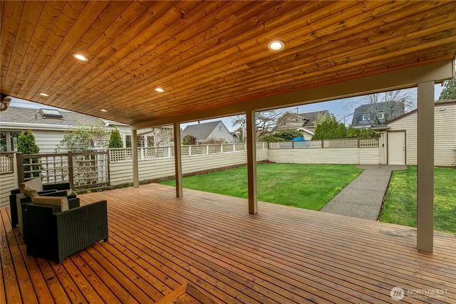 a view of a patio with wooden floor