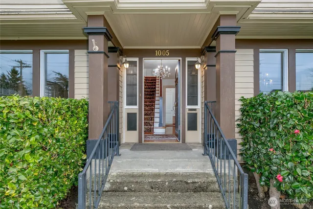 a view of a house with potted plants