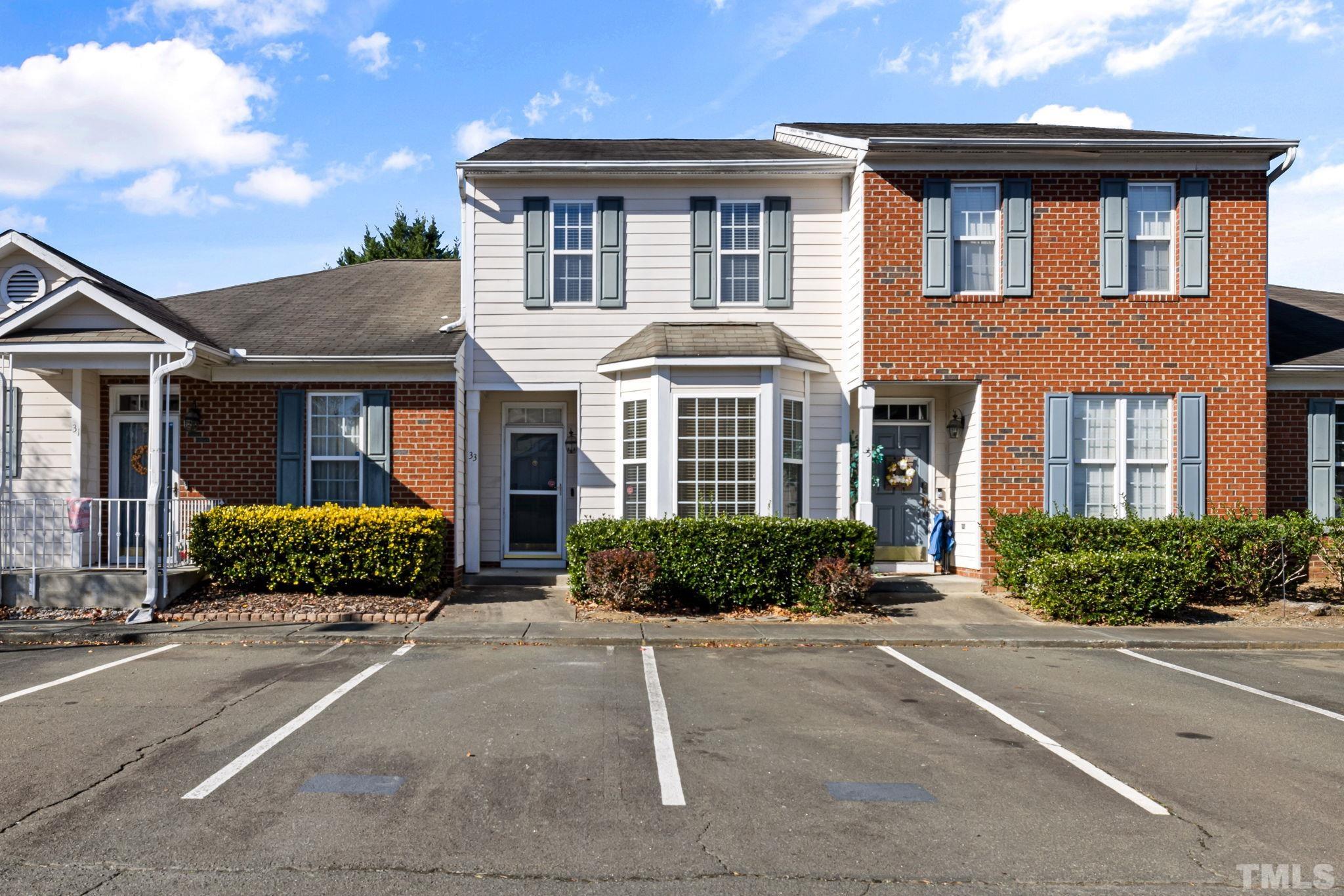 33 Signet Drive Durham, NC 27705 - Photo 1 of 37 a front view of a brick house with a yard