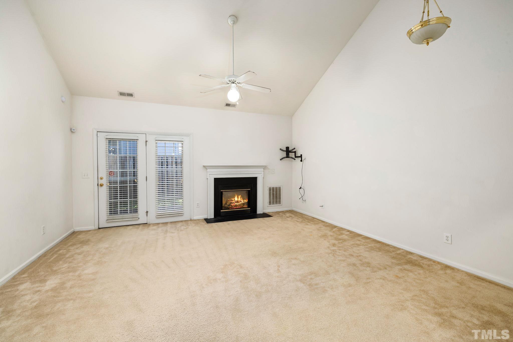 33 Signet Drive Durham, NC 27705 - Photo 15 of 37 an empty room with windows and fireplace