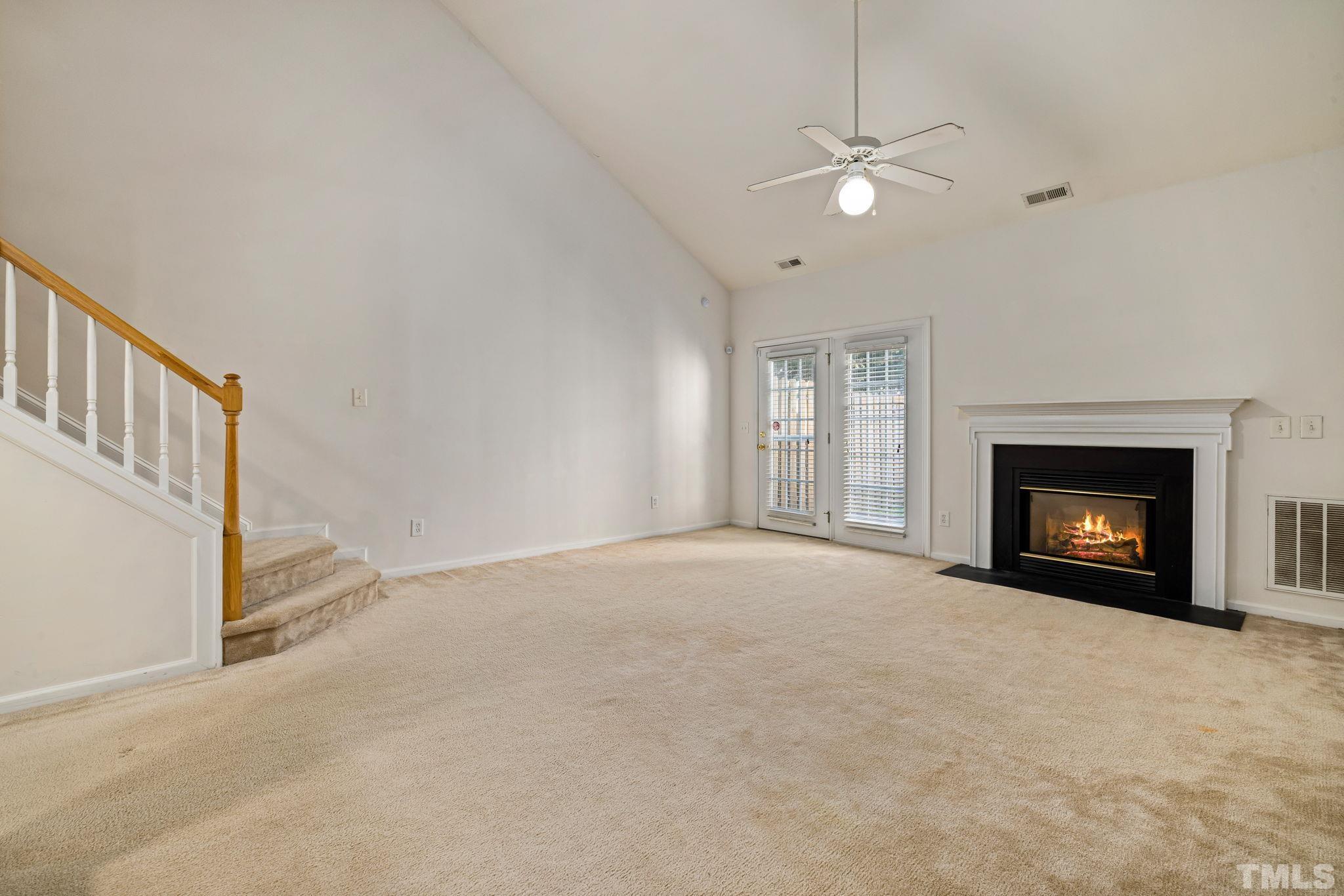 33 Signet Drive Durham, NC 27705 - Photo 17 of 37 a view of an empty room with a fireplace and a window