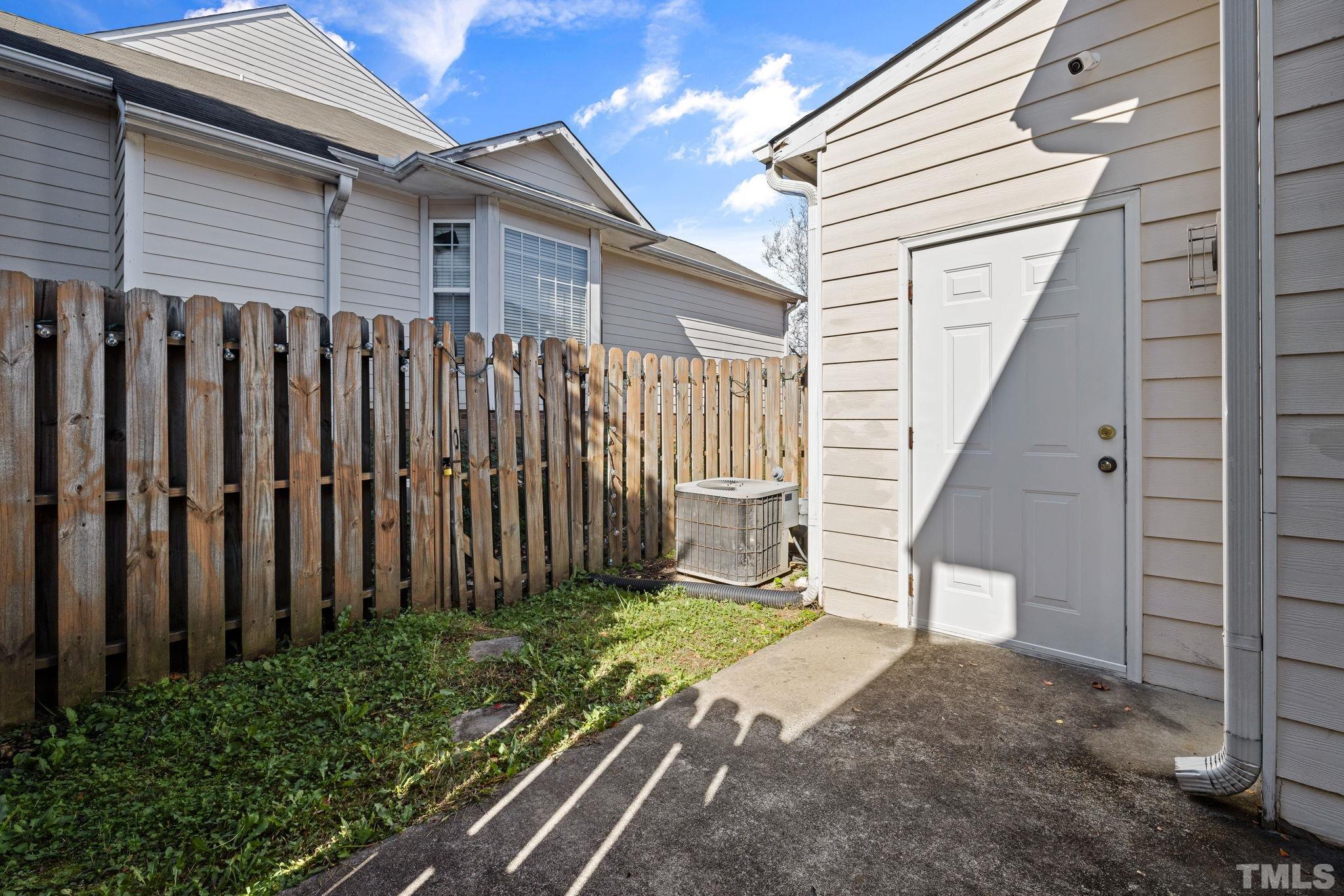 33 Signet Drive Durham, NC 27705 - Photo 34 of 37 a view of a backyard with wooden fence