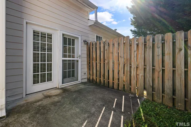 a view of a pathway with a backyard