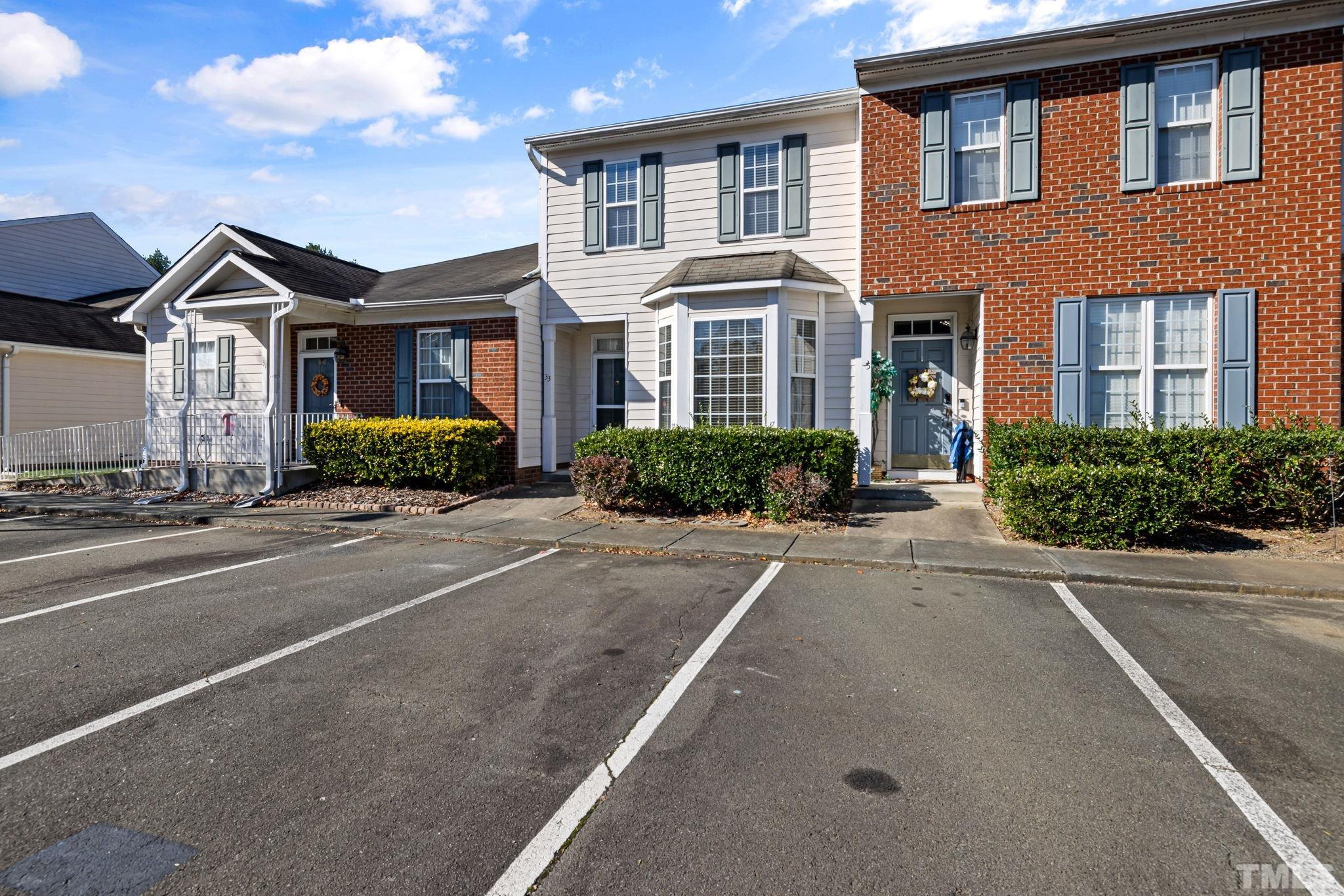 33 Signet Drive Durham, NC 27705 - Photo 6 of 37 a front view of a house with a yard