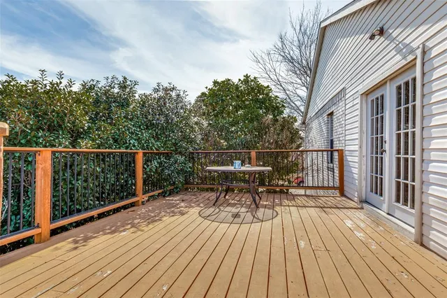 a view of a roof deck with wooden floor and seating