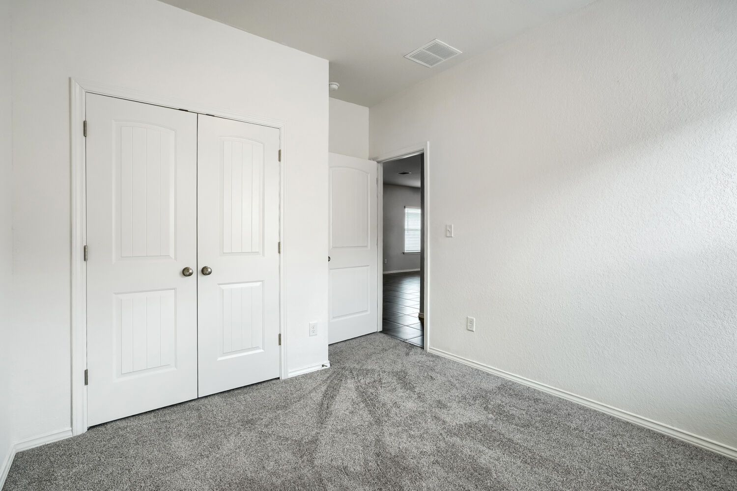2420 Ranger Pass Seguin, TX 78155 - Photo 21 of 28 Plush grey carpeting extending throughout the room, contrasted by bright white walls and trim