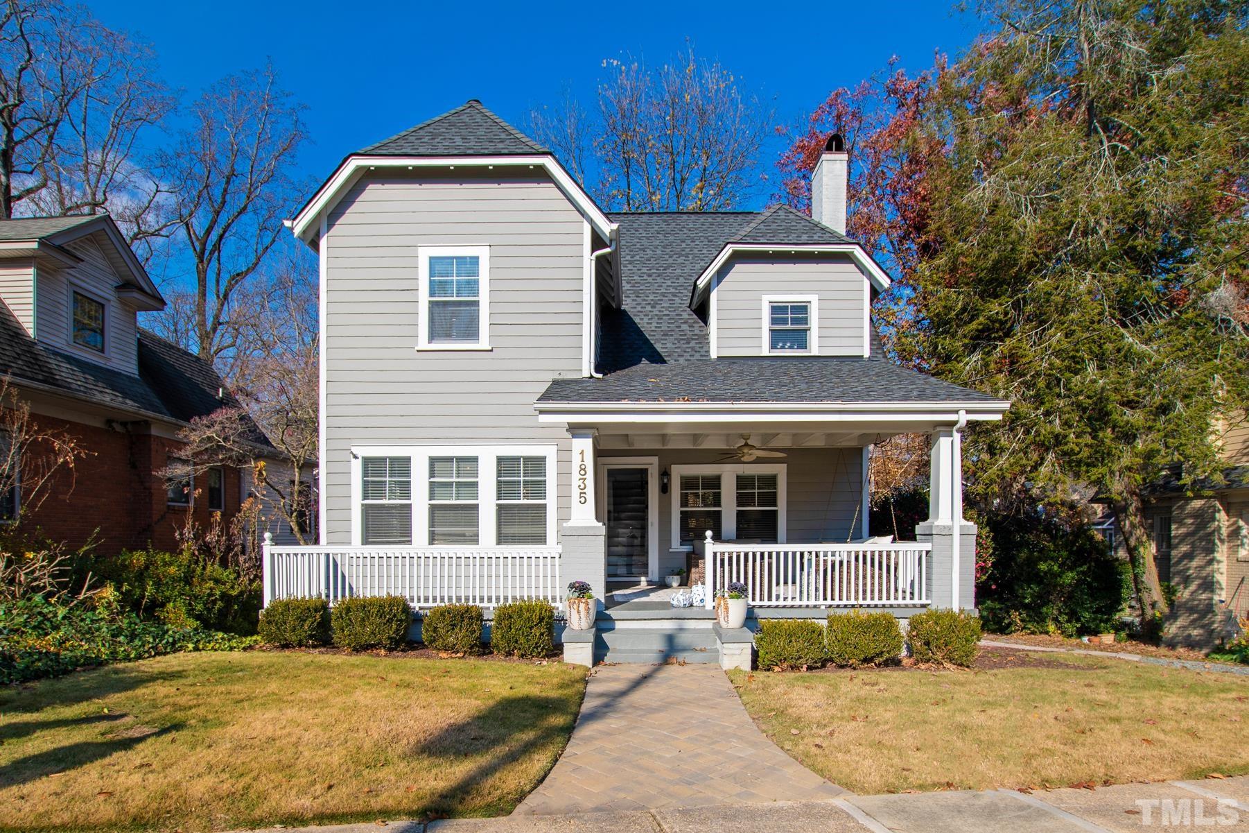 1835 White Oak Road Raleigh, NC 27608 - Photo 1 of 35 a front view of a house with a yard