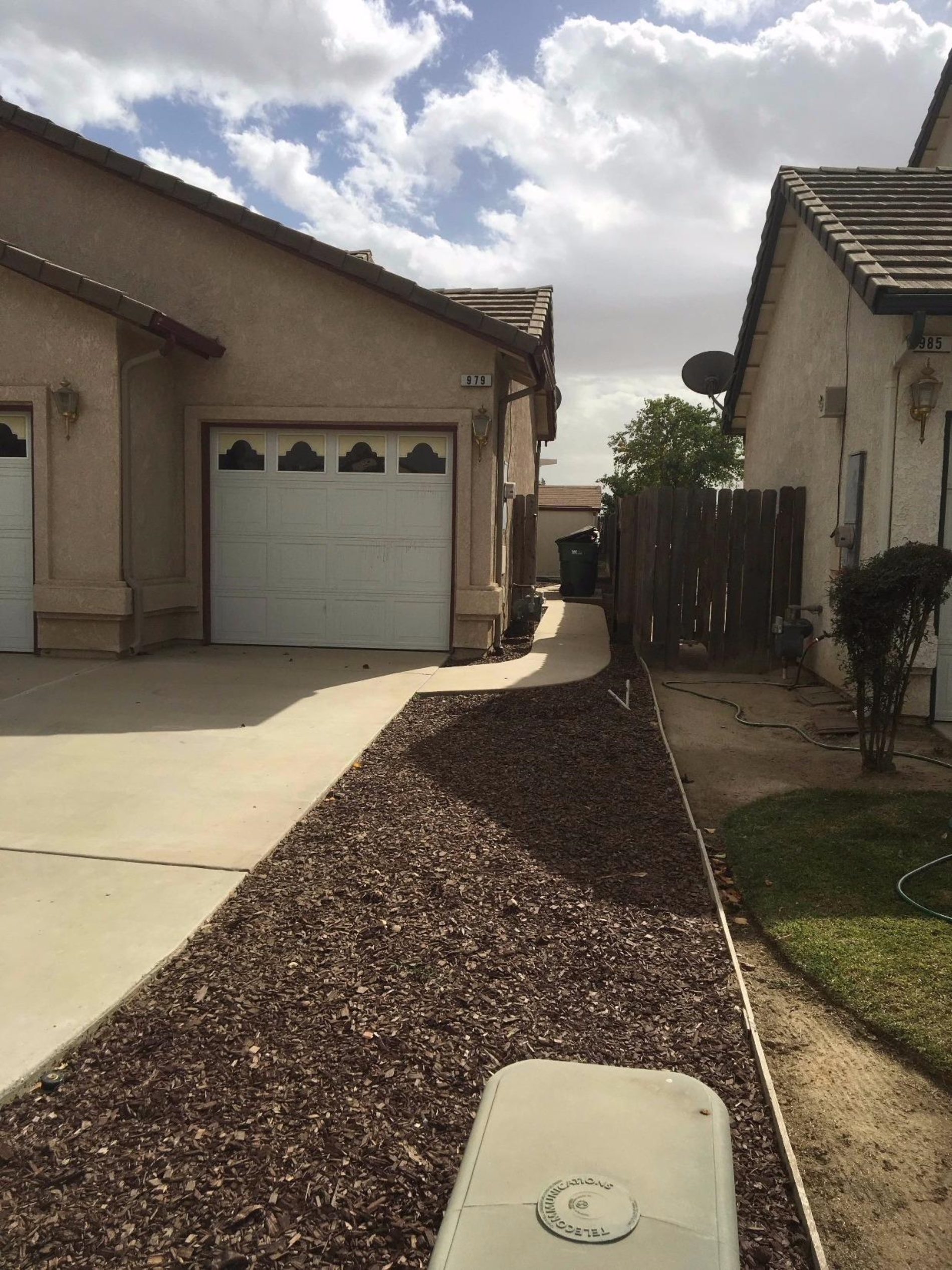979 Maple Avenue Fowler, CA 93625 - Photo 2 of 10 a front view of a house with a yard
