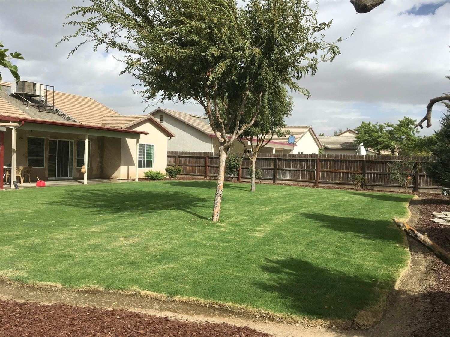 979 Maple Avenue Fowler, CA 93625 - Photo 4 of 10 a view of a house with a yard