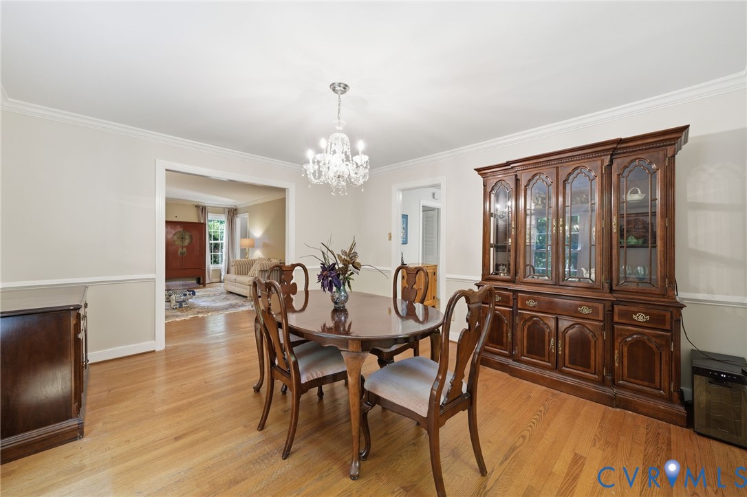 2101 Castlebridge Road Midlothian, VA 23113 - Photo 18 of 37 a view of a dining room with furniture and chandelier