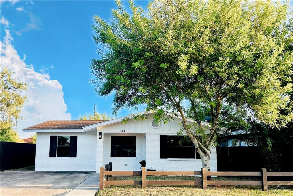 a front view of a house with street