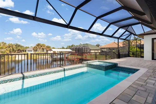 a view of swimming pool with a patio