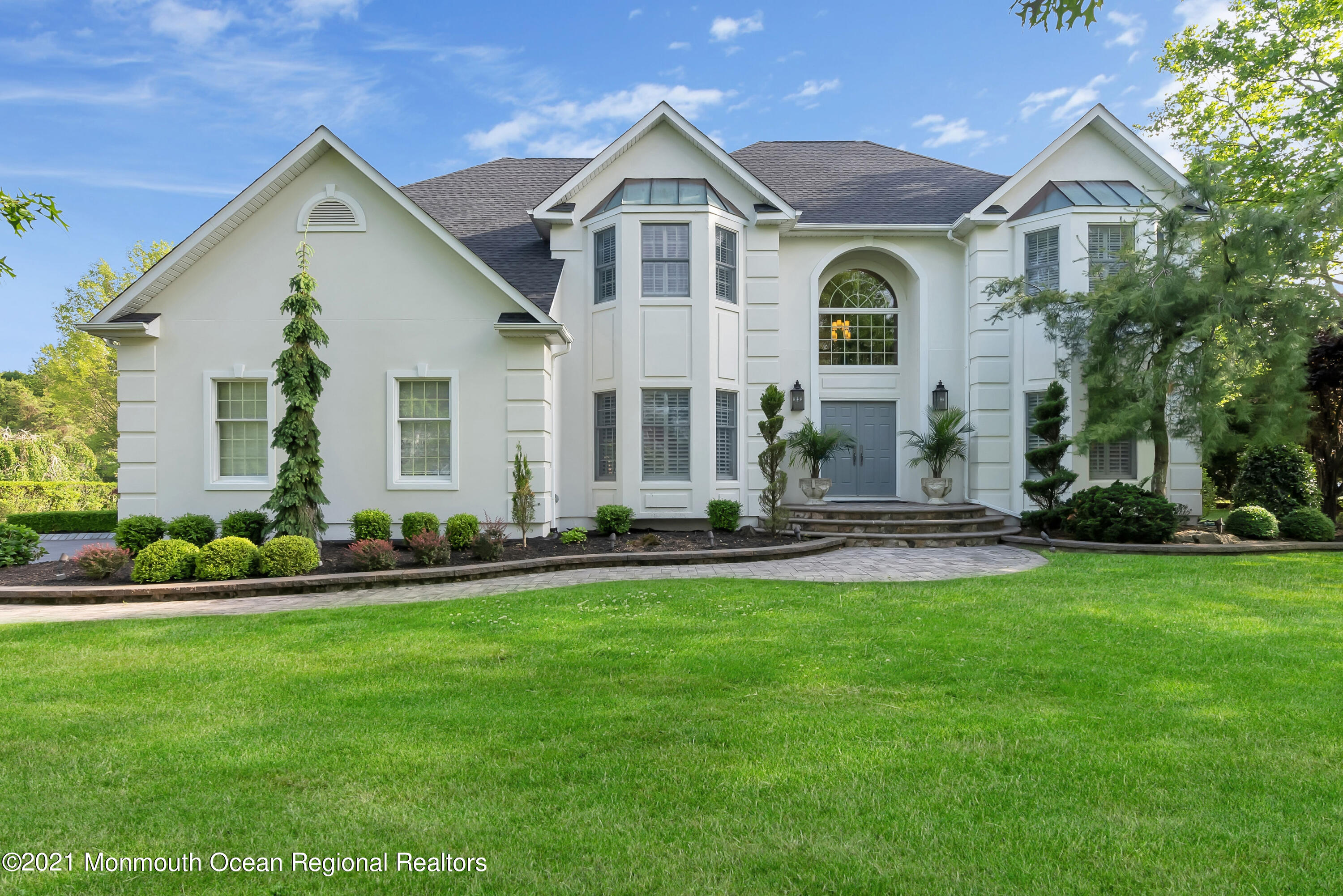 a front view of a house with a yard