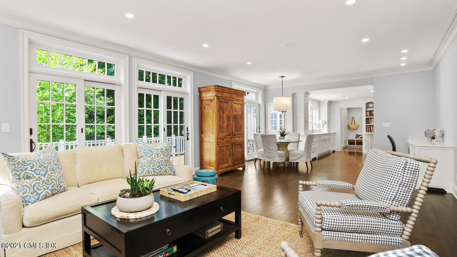 145 Lockwood Road Riverside, CT 06878 - Photo 8 of 43 a living room with furniture and floor to ceiling windows