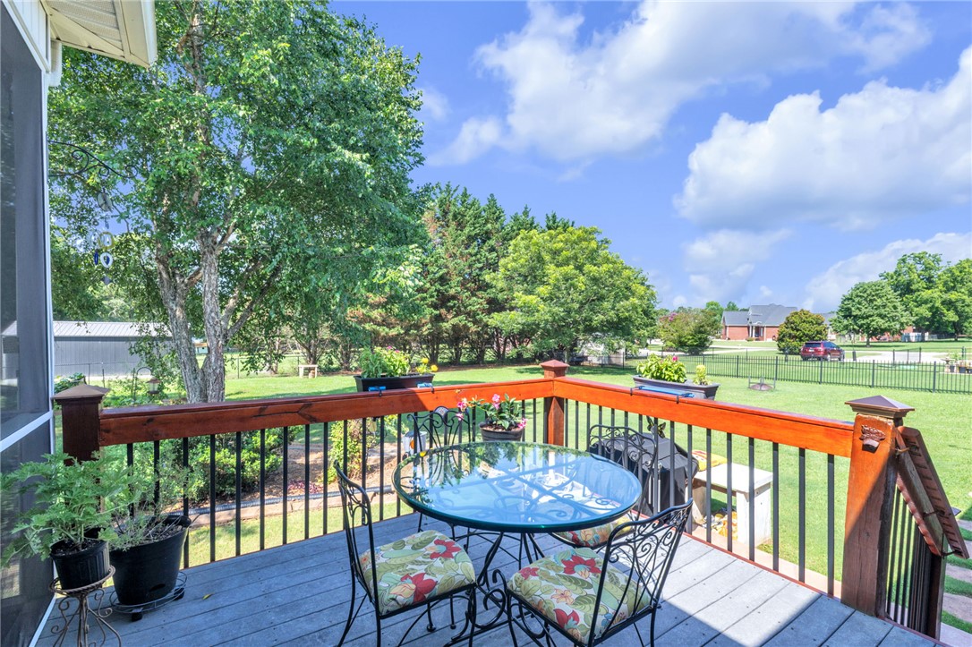 648 Mountain View Road Williamston, SC 29697 - Photo 30 of 42 Enjoy idyllic views of the natural surroundings from this welcoming outdoor deck, ideal for quiet relaxation.