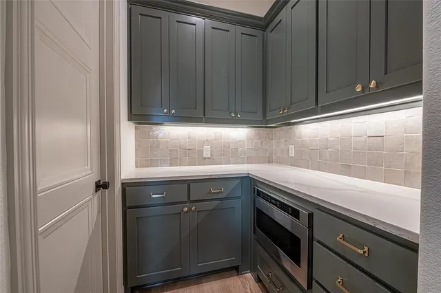 a bathroom with a sink a mirror a window and a window