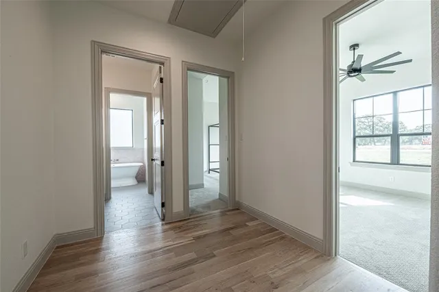 a view of a kitchen with a sink and chandelier