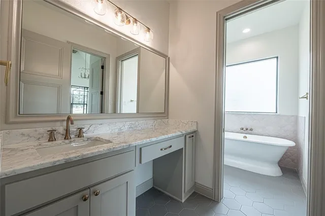 a view of a room with wooden floor mirror and windows