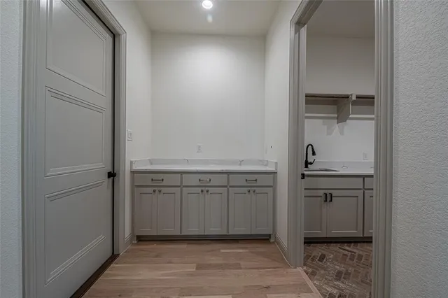 a bathroom with a granite countertop toilet sink and mirror
