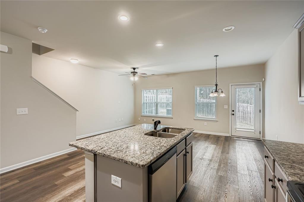 1901 Creel Lane Atlanta, GA 30349 - Photo 14 of 28 a kitchen with a counter space wooden floor and appliances