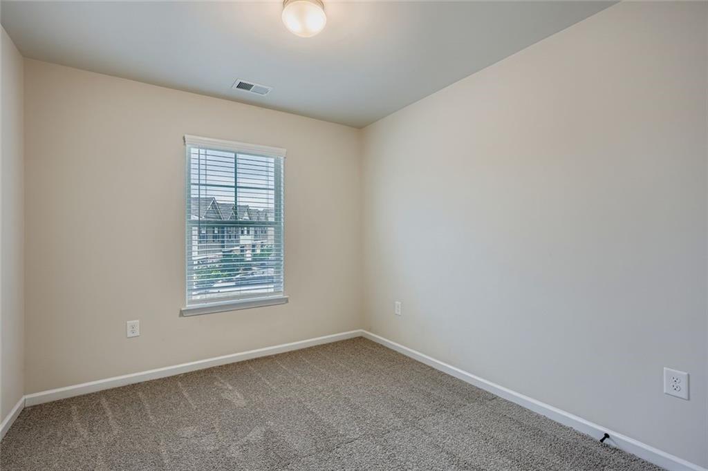 1901 Creel Lane Atlanta, GA 30349 - Photo 21 of 28 an empty room with a window
