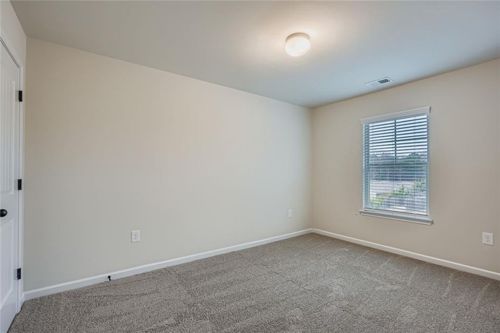 1901 Creel Lane Atlanta, GA 30349 - Photo 22 of 28 an empty room with a window