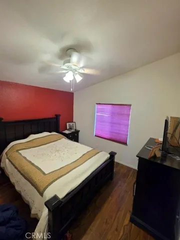 a bed room with a bed and a computer