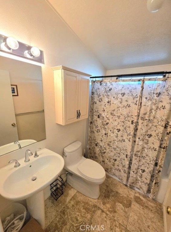 27250 Murrieta Road, Unit 390 Menifee, CA 92586 - Photo 19 of 30 a bathroom with a sink toilet and shower