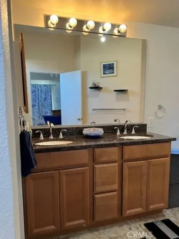 a kitchen with cabinets a sink and appliances