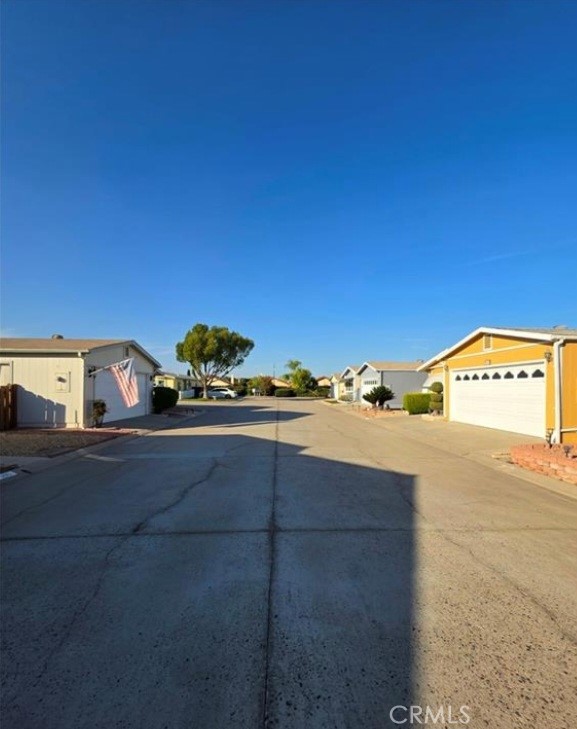 27250 Murrieta Road, Unit 390 Menifee, CA 92586 - Photo 4 of 30 a view of a street with an houses