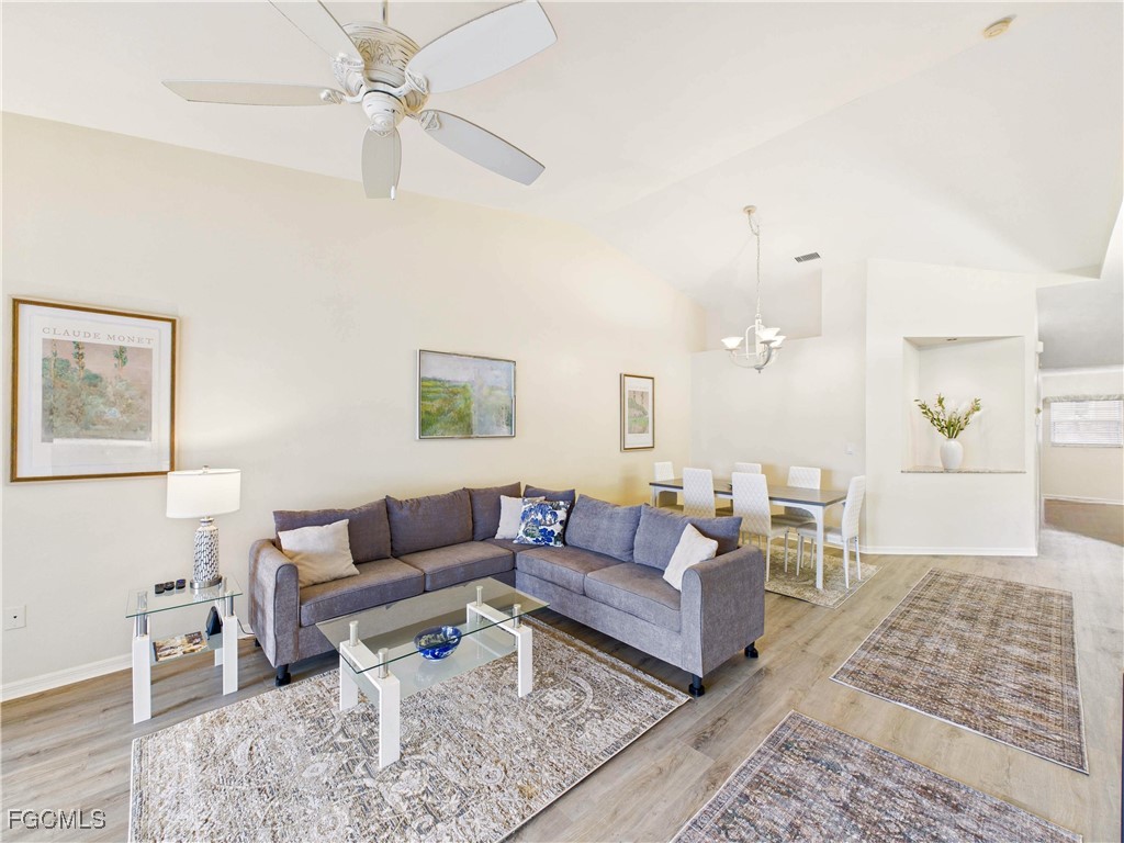 7435 Plumbago Bridge Road, Unit K201 Naples, FL 34109 - Photo 11 of 35 a living room with furniture and a rug